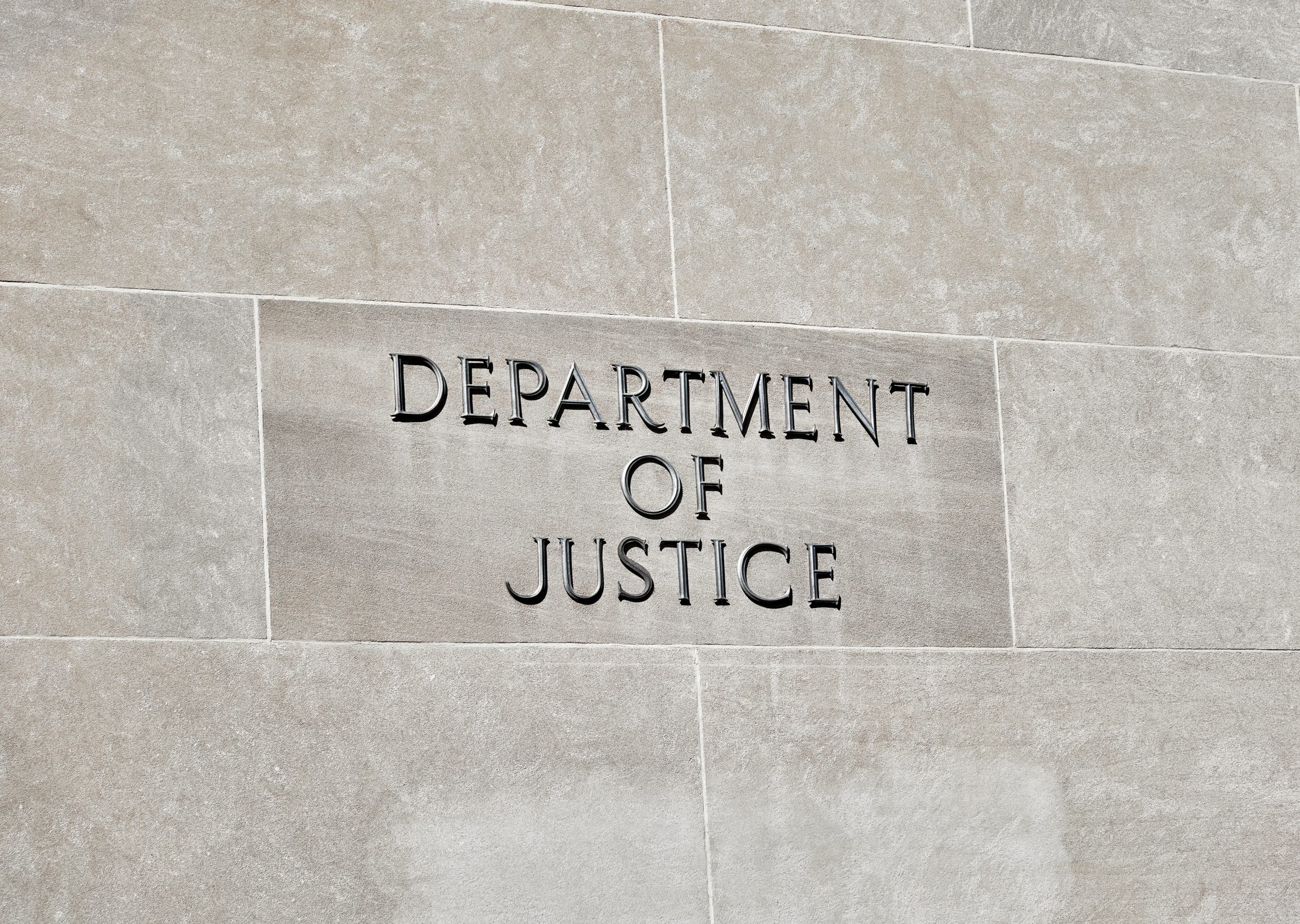 Washington DC, USA-June 5, 2018: Robert F Kennedy Department of Justice building sign on stone wall