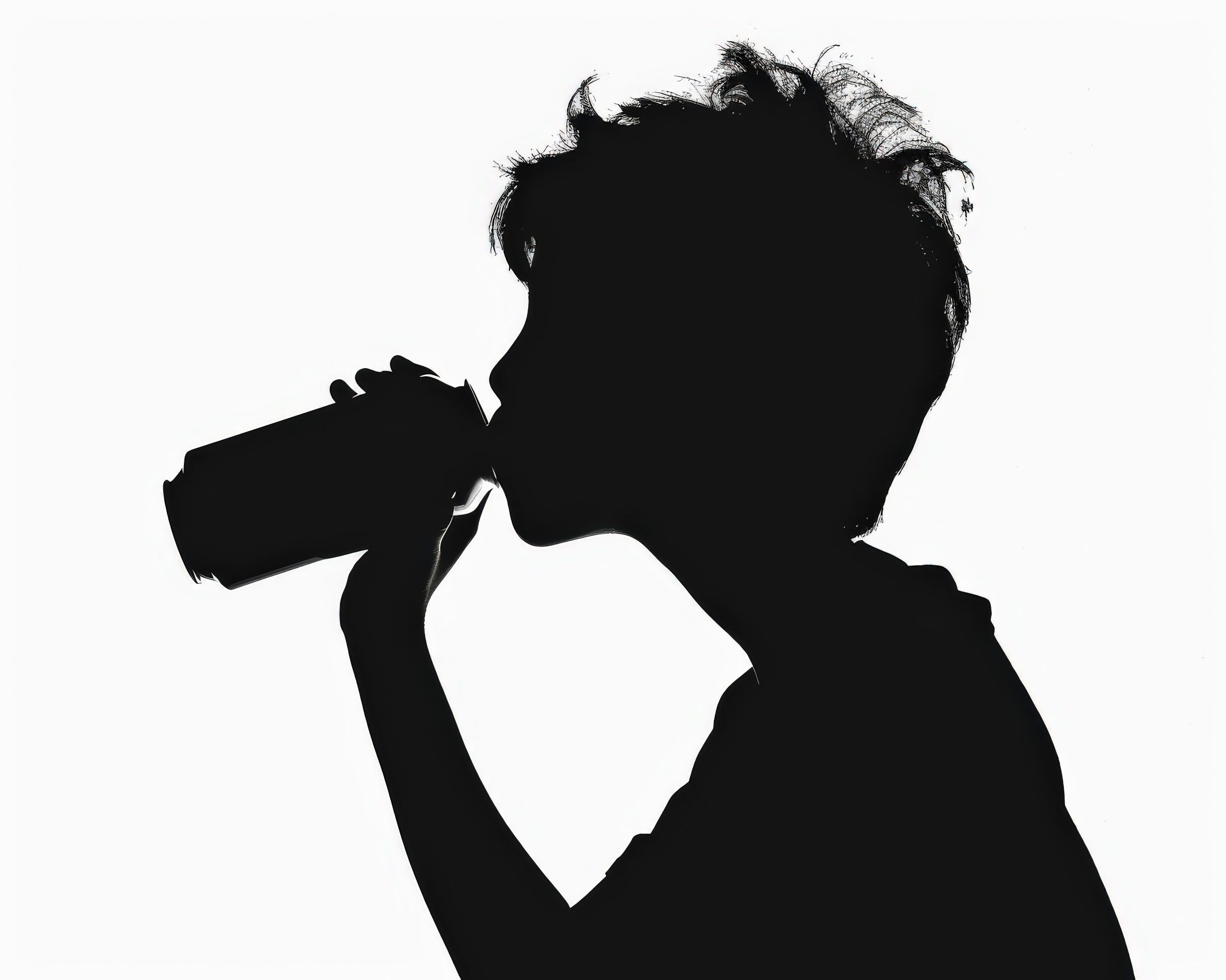 Silhouette Drinking. Teen Boy Drinking from Can Silhouette in School Setting
